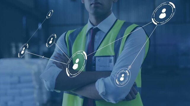 Warehouse supervisor folding arms, causing animated network overlay expanding forward for logistics
