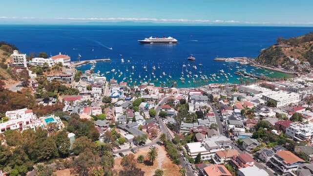 Dolly shot of Avalon on Catalina Island from the land toward the ocean with the cruise ship in the background