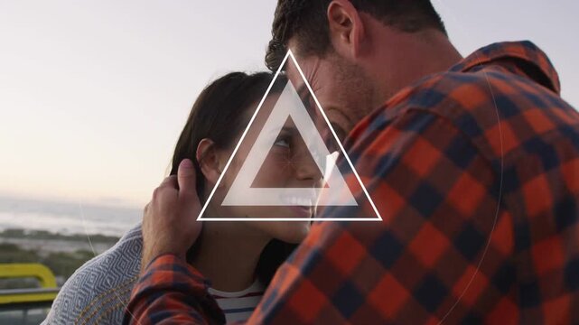 Man cradling partner, pair nuzzling at dusk, marketing ring+triangle pulsing masking faces