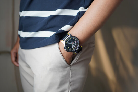 Casual Man Wearing Black Chronograph Watch with Modern Street Style Outfit