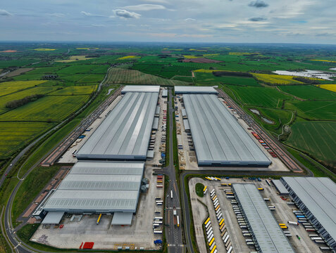 Aerial view of Appleby Magna Industrial Park featuring large warehouses and distribution centers surrounded by green fields in Appleby Magna, England, United Kingdom.