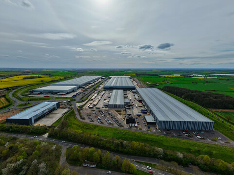 Aerial view of Appleby Magna Industrial Park featuring large modern warehouses, logistics facilities, and parking areas surrounded by green fields Appleby Magna, England, United Kingdom.