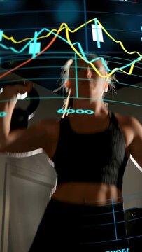 Vertical video: Woman gripping kettlebell, lifting overhead for fitness with chart overlay moving