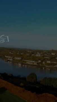 Vertical video: River town staying still, floating formula spreading across sky showing math