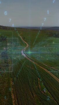 Vertical video: Drone moving starting HUD while cyan scan point moving along road for crop mapping