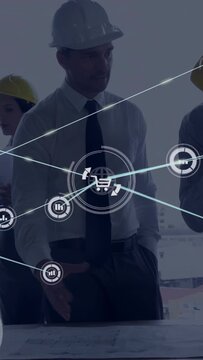 Vertical video: Site lead pointing at plans and activating data icons over table to aid planning