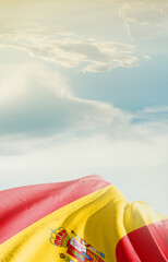 Spain national flag waving in beautiful sky. Spain national flag for independence day.