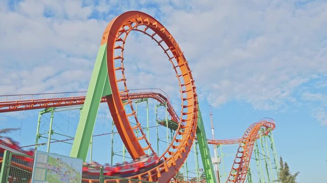 Roller Coaster Train Speeding Through Vertical Loop
