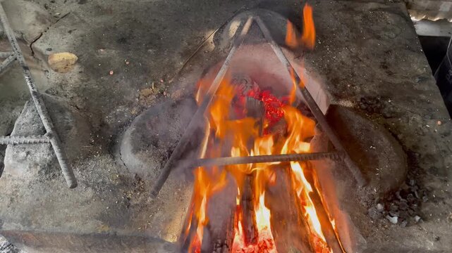 Traditional Wood Fire Stove with Open Flames for Cooking