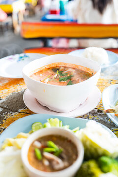 A steaming hot bowl of spicy seafood soup. Thai seafood