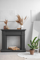 Obraz premium Interior of living room with decorative fireplace and mirror