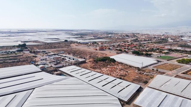 industry landscape modern development agriculture field greenhouse invernaderos plastic sea drone - Andalusia, Spain - 2025