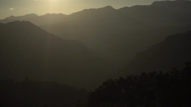 silhouette picture of mizoram on the mountain at sunset