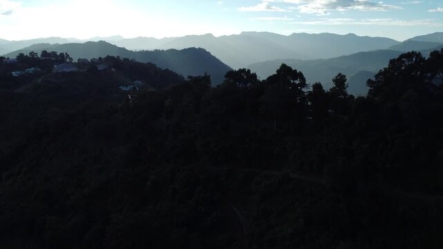The light of the sunset has created parallel lines on the hills.