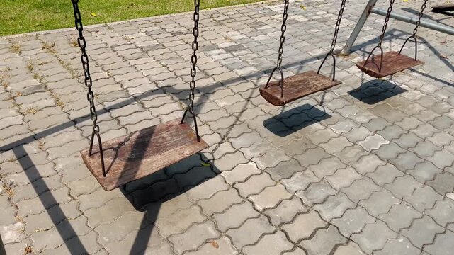 Wooden swings at playground
