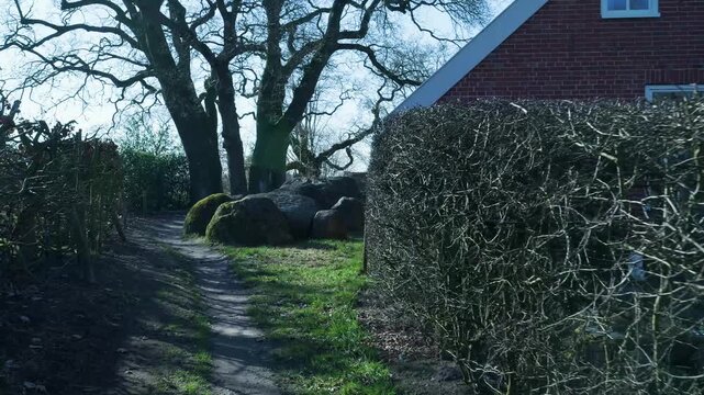 Dolly shot of a dolmen in a garden