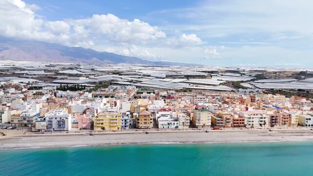 city vacation apartment building facade beach sea coast border blue sky summer urban town industry plastic sea - Andalusia, Spain - 2025