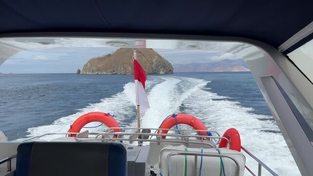 Speedboat Cruising in Labuan Bajo Ocean with Indonesian Flag Waving