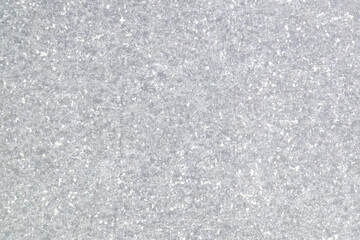 Obraz premium Gray speckled stone texture background with a rough, natural appearance