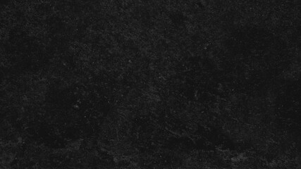 Fototapeta premium Dark textured desktop wallpaper with a rough, stone-like appearance in deep black tones