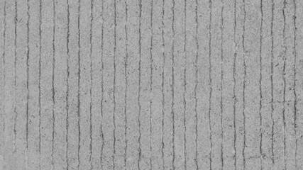 Gray concrete desktop wallpaper with vertical grooves and a rough texture