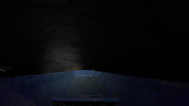 Fixed camera position down in a boat, cruising through Kong Lor cave's underground river system.