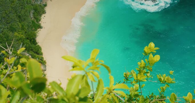 Top down view of crystal clear turquoise ocean water at Nusa Penida Bali Kelingking Beach