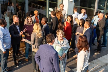 Diverse group outdoor networking event