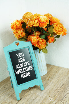 You Are Always Welcome Here message written on easel