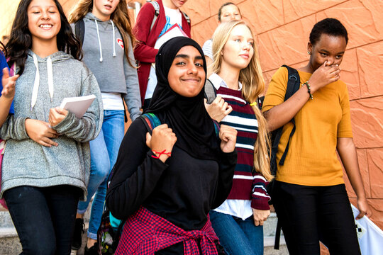 Diverse students walking together photo