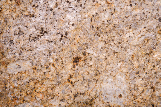 Close up of weathered granite surface texture. Intrusive igneous rock