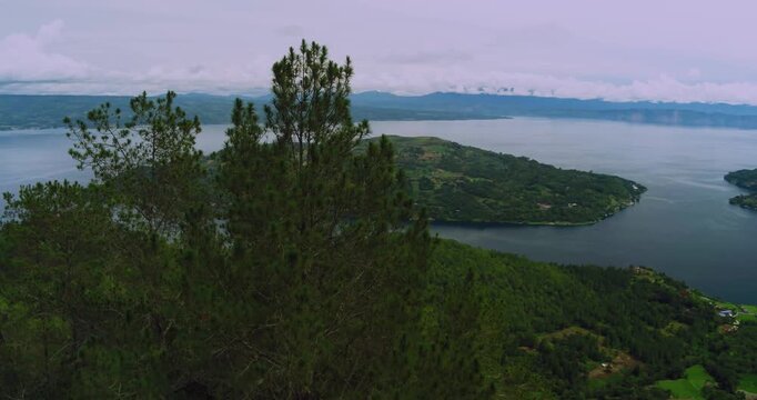 Aerial Drone Lake Toba Island View Surrounded by Hills Tropical Landscape
