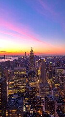 Obraz premium Aerial view of a towering city skyline at dusk with the sun setting