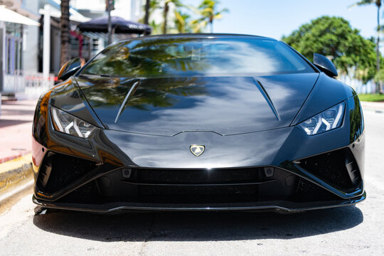 Miami, Florida, USA - July 27, 2025: Lamborghini Huracan EVO Spyder 2020 convertible car. Luxury Lamborghini Huracan EVO Spyder. Car Lamborghini convertible parked outdoor. Black car, front view.