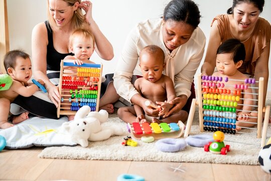 Diverse toddlers playing together joyfully.