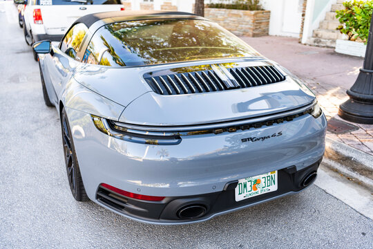 Miami, Florida, USA - July 27, 2025: Porsche 911 Carrera 2023 GTS Cabriolet convertible car. Luxury car Porsche 911 Carrera. Car Porsche 911 Carrera parked outdoor. Grey convertible car, rare view.