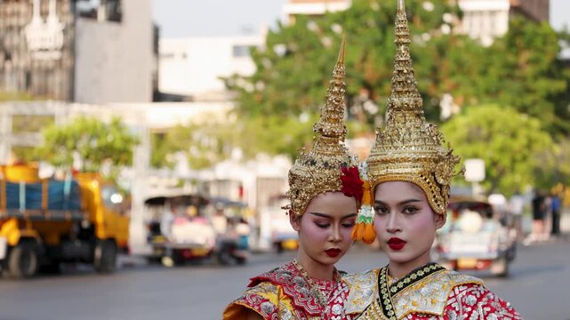 Traditional Thai Khon Dancers in Golden Chada Headdresses on Bangkok Street