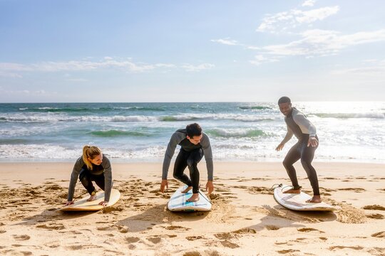 Surf lesson on sandy beach