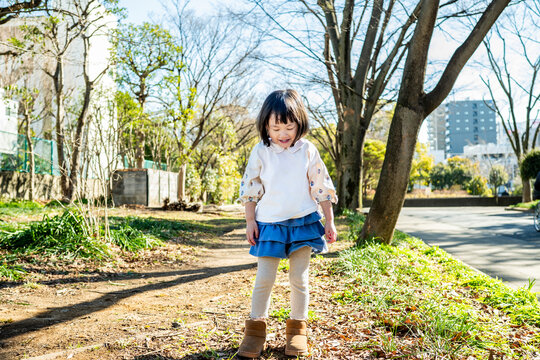 Close-up Portrait of a Happy Little Japanese Girl Outdoors in Winter
