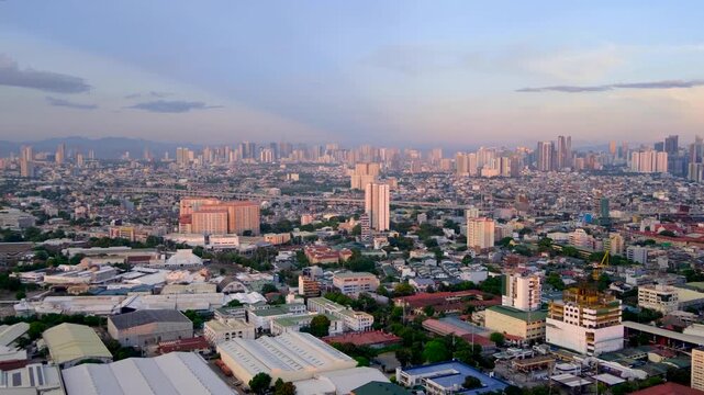 Aerial cityscape view of vast sprawling capital city of Manila in Philippines with densely packed buildings
