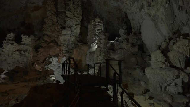 Push forward reveal of Kong Lor's large cavern with impressive stalactites and stalagmite formations.