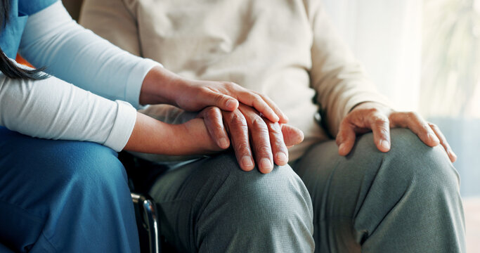 Nurse, holding hands or old man in wheelchair at nursing home, support or trust for rehabilitation. Assisted living, caregiver or senior person with disability for medical care, comfort or kindness