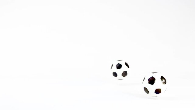 Miniature Soccer Ball Bouncing and Rolling Across a White Background