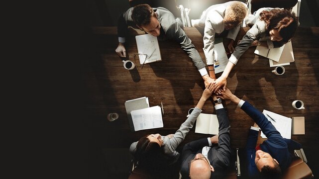 Business people are joining hands together
