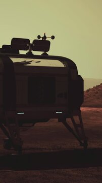 A lander is positioned on the surface of Mars, surrounded by rocky terrain. The scene captures the dusk light, casting shadows and highlighting the barren landscape.