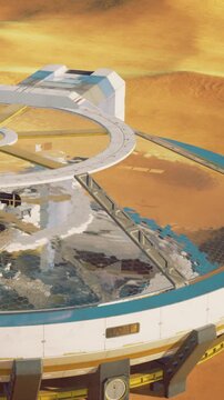 A view of a Mars exploration base shows the design of buildings and a walkway. The landscape features colorful patches of land and an orange sky at sunset.