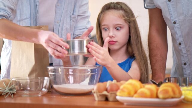 Family bonding moment in the kitchen as parents and daughter bake together, capturing warmth, love, and meaningful time before a farewell