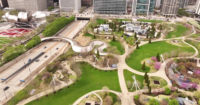  Aerial Drone View of Maggie Daley Park and Pedestrian Bridge Over Columbus Drive in Downtown Chicago on a Spring Day