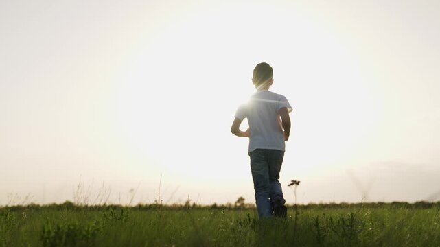 boy son child running airplane game flight dream playground green field sunset pilot, fun flying playtime, child on green field, child sunset plane game, young boy airplane passion, playtime at dusk
