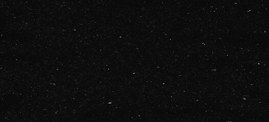 Fototapeta premium white dust and scratches on a black background. The texture of dirt on the glass